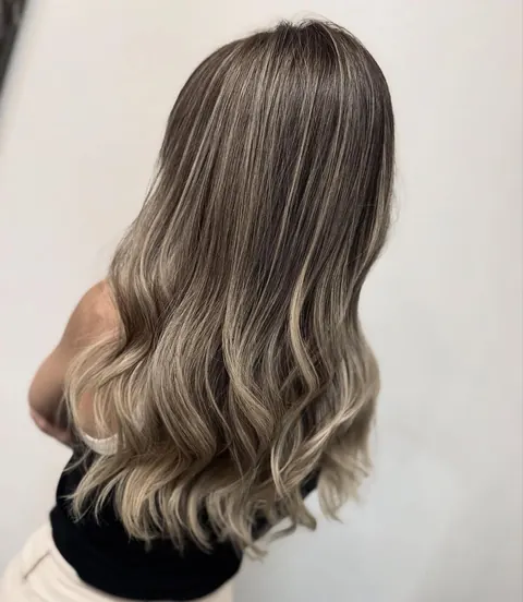 Ash blonde waves with soft dimension