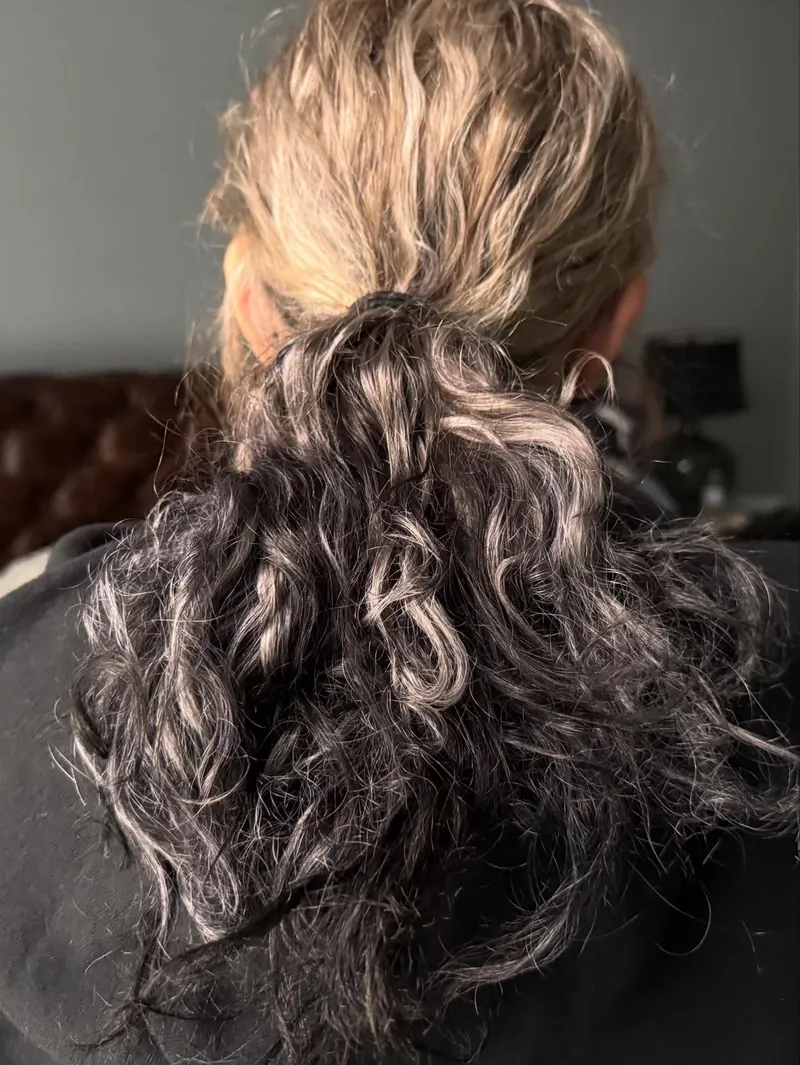 Start: freshly dyed black hair, partway through lightening