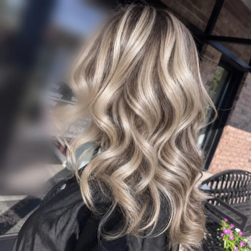 Bright blonde curls four months after her last highlight