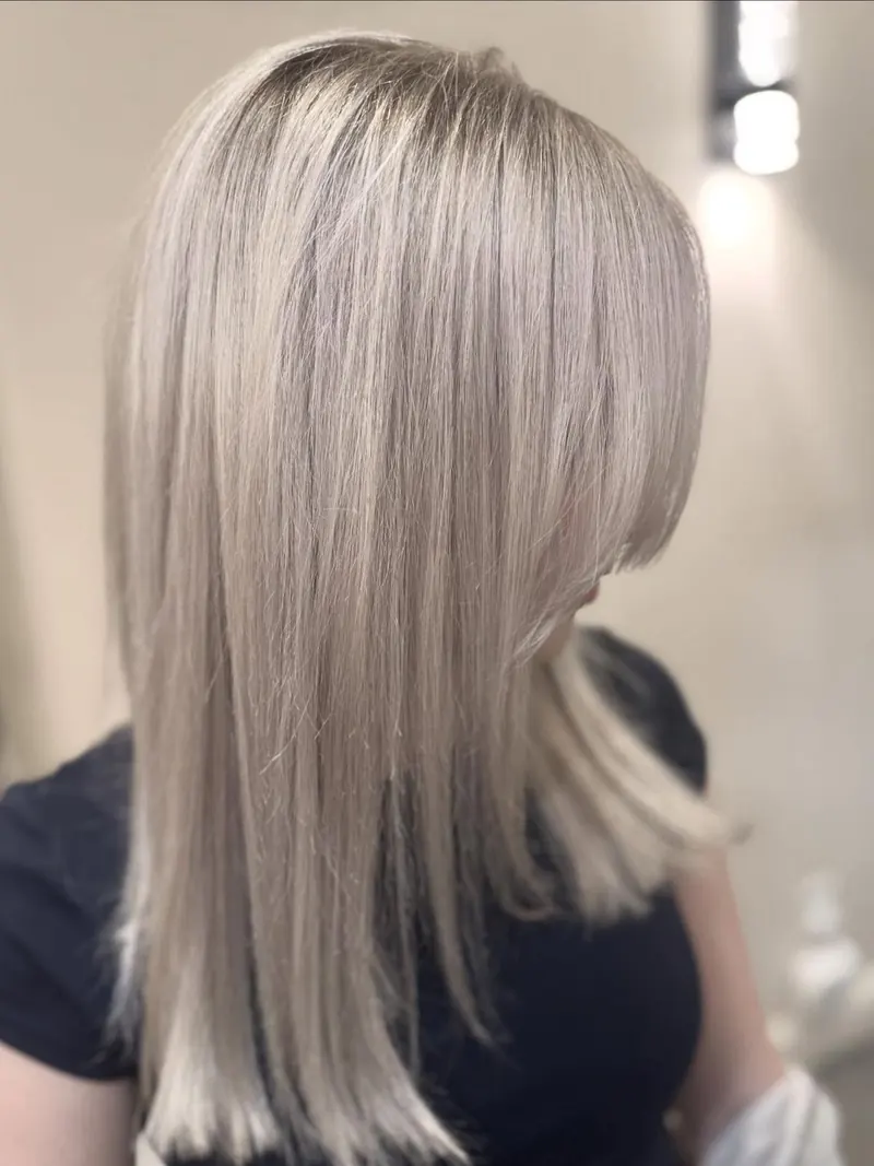 After: seamless icy blonde, straight and glossy